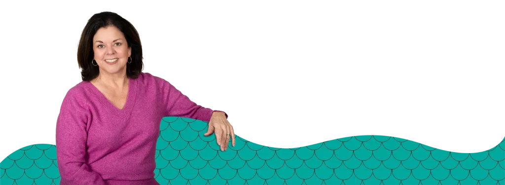 Kimberly Fish of Fish Tails with her arm draped across some graphical fish scales